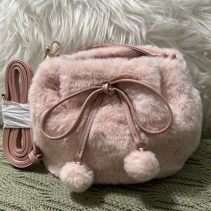Cato Blush Pink Faux Fur Crossbody Bag with Pom Pom Accents